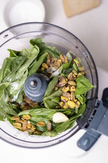 basil, pesto, garlic, salt, and lemon juice in a food processor