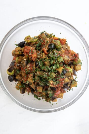 eggplant caponata topped with chopped parsley