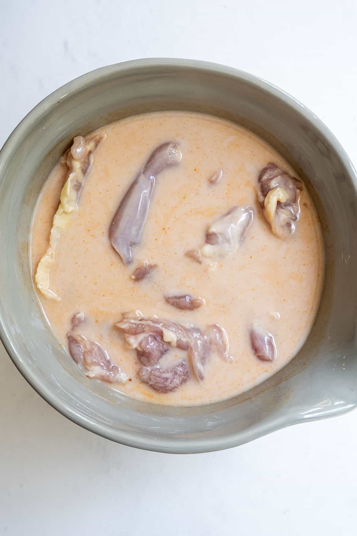 fried chicken marinating in buttermilk