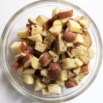 Seasoned potatoes in a bowl.
