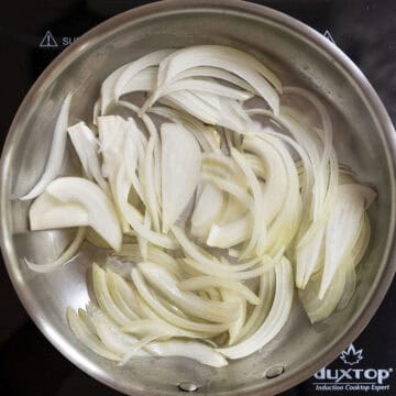 Onions frying in the frying pan.