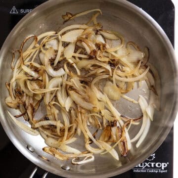 Onions caramelized in the frying pan.