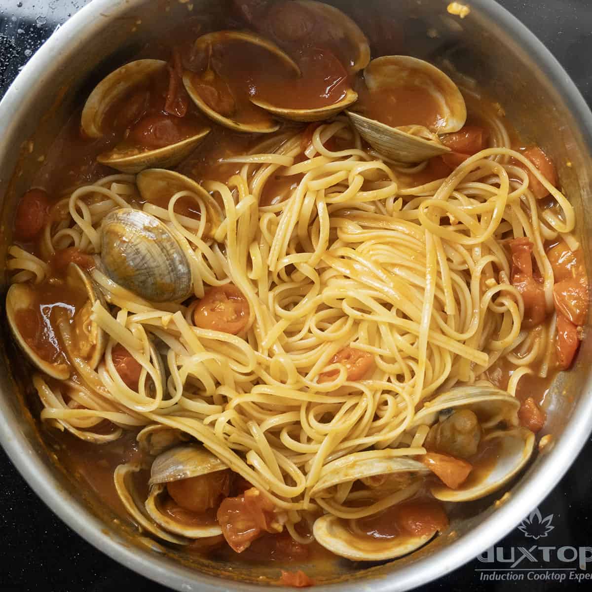 Pasta added to the sauce.