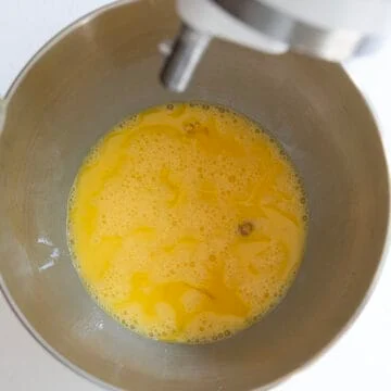 Eggs whisked in a kitchen aid mixer.