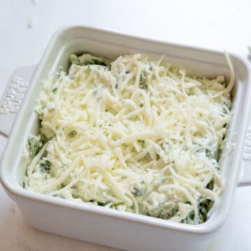 Spinach and artichoke dip topped with mozzarella.