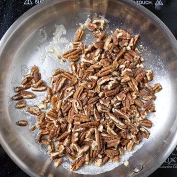 Toasting pecans in a saucepan.