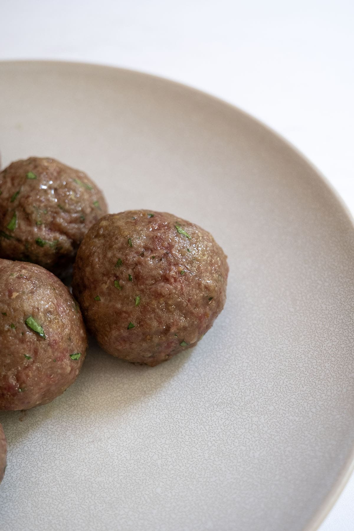 Pile of baked meatballs showing softer texture.