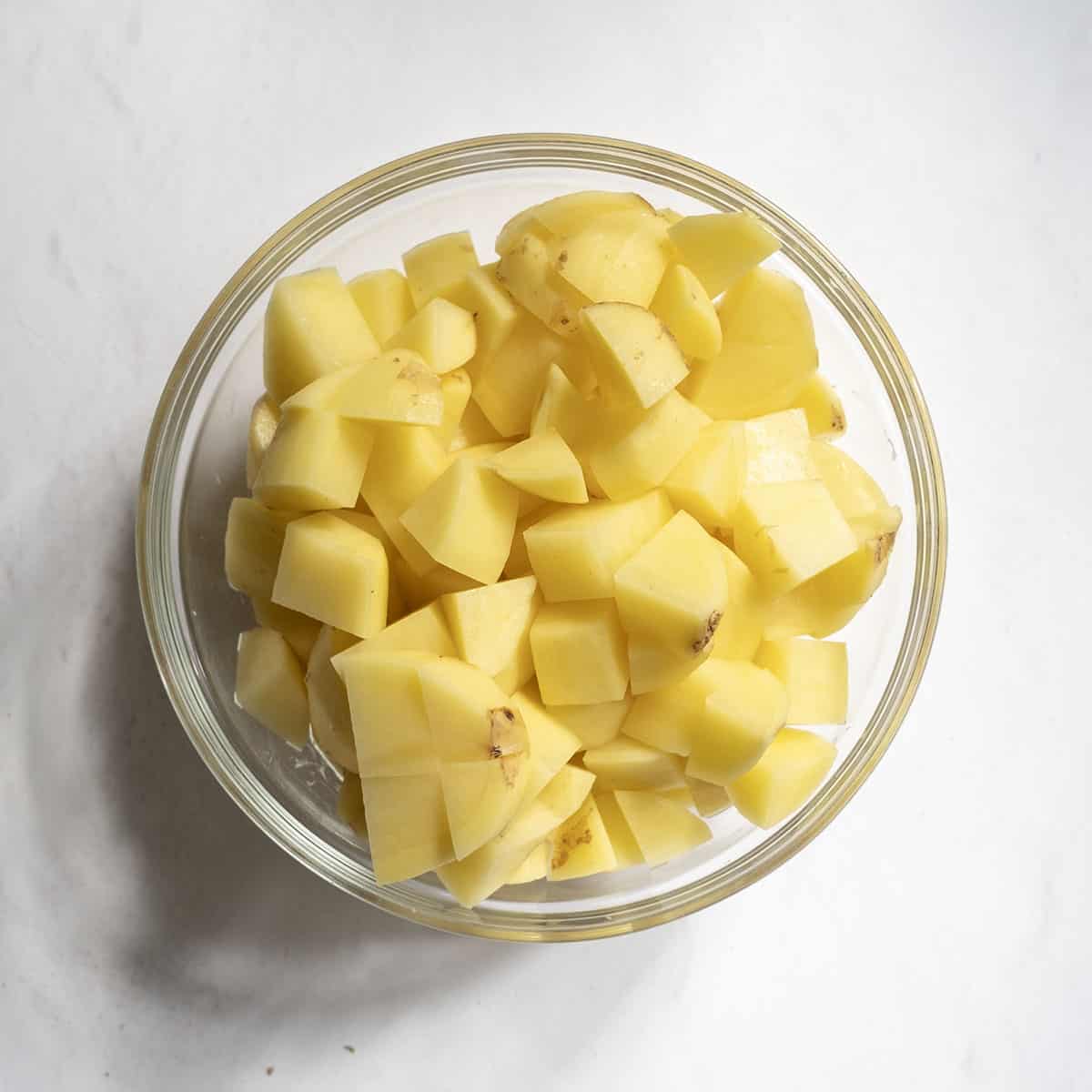 Potatoes chopped to ¾ inch pieces in a bowl.