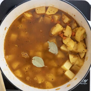 Potatoes added to pot with broth.