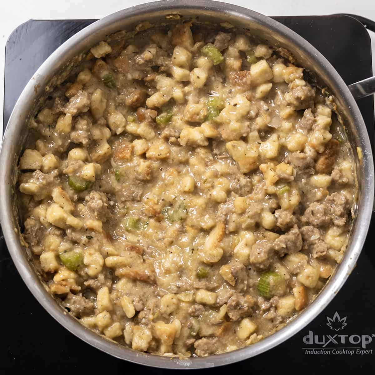 Stuffing in a saucepan with sausage and bread stuffing.