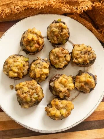 Italian sausage stuffed mushrooms on a plate.