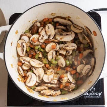 Mushrooms sauteing with the vegetables.