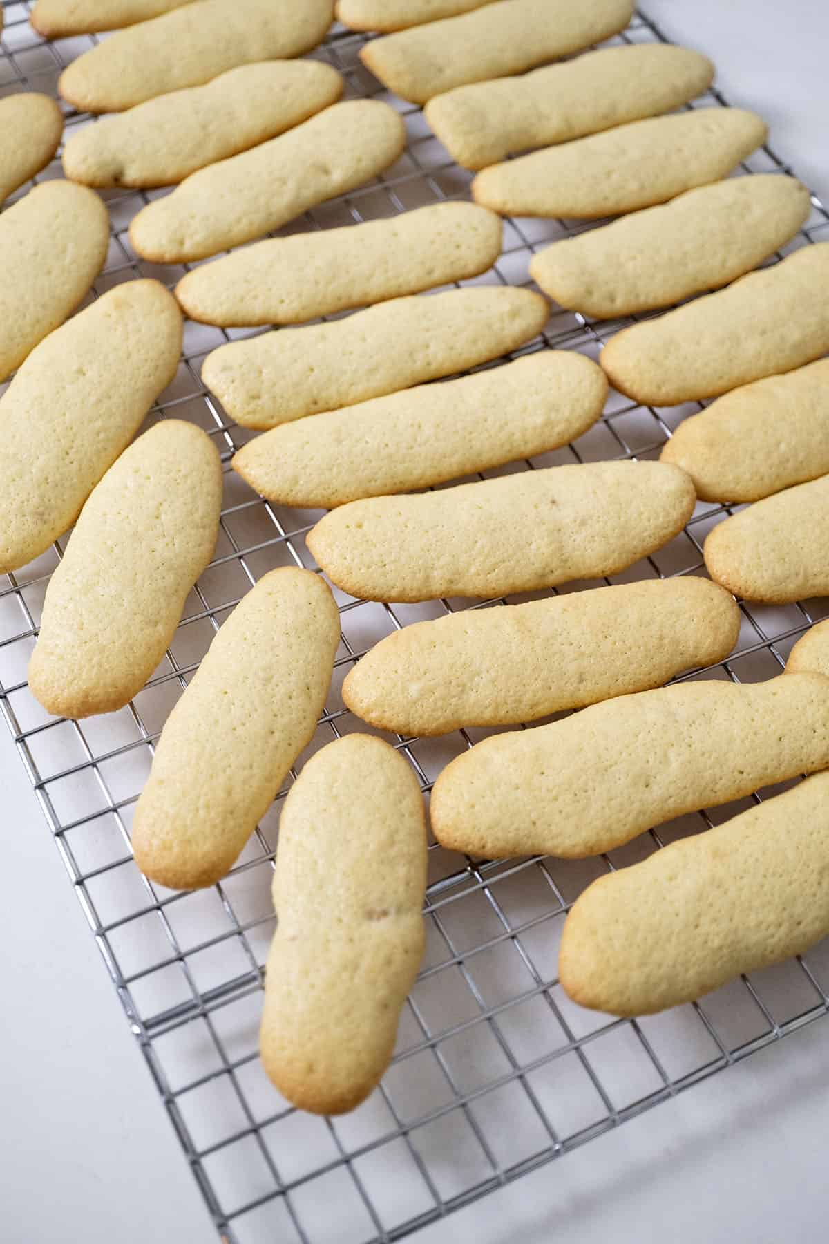 Ladyfingers on a cooling rack.