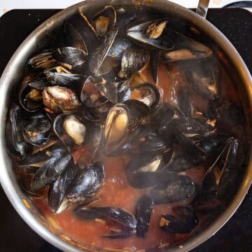Mussesls steamed and opened in a pan with the fra diavolo sauce.