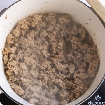 Browning sausage in a pot.
