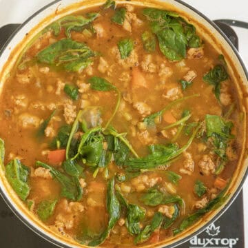 Spinach wilting in the soup.