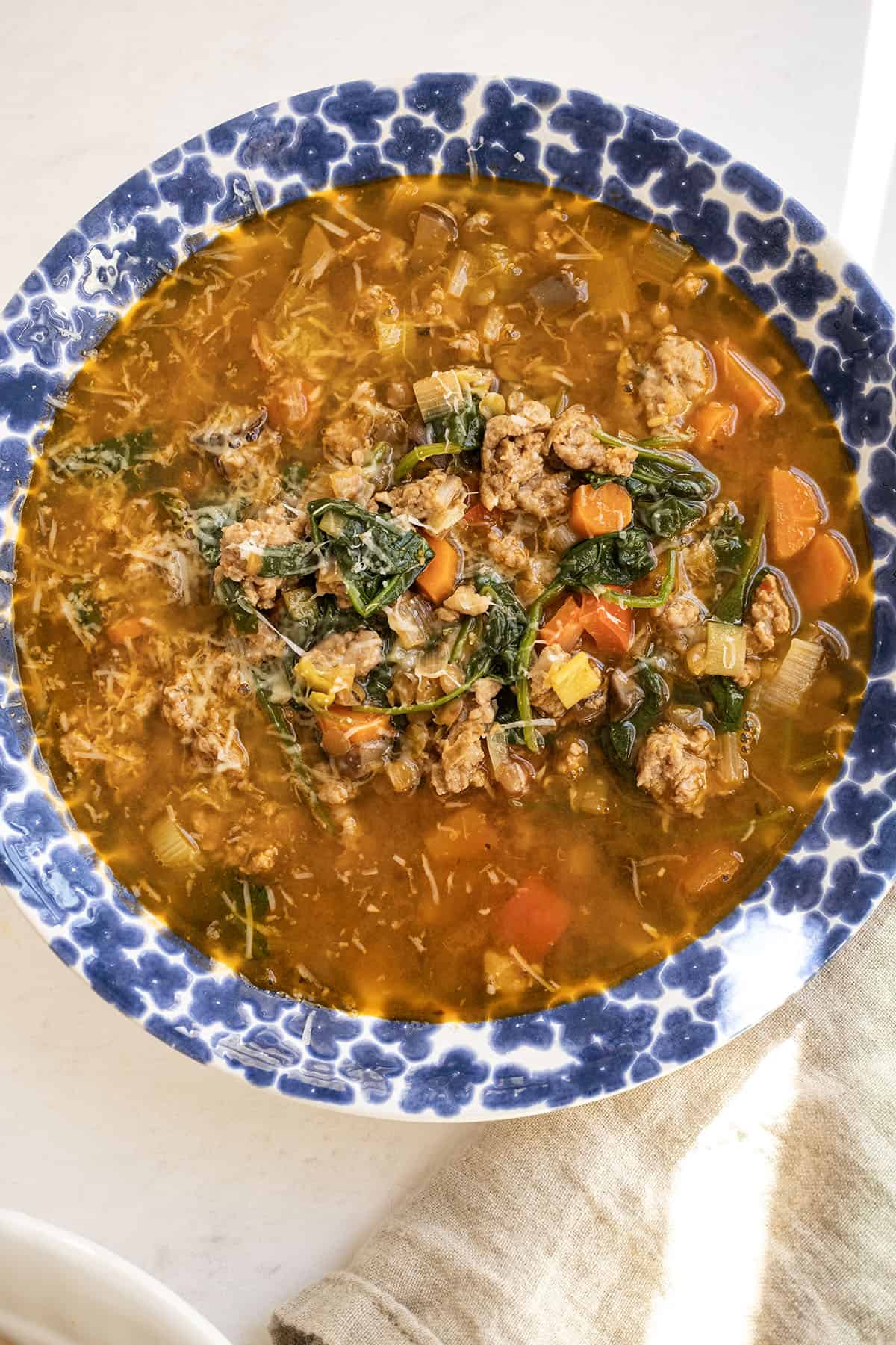 Bowl of sausage and lentil soup.