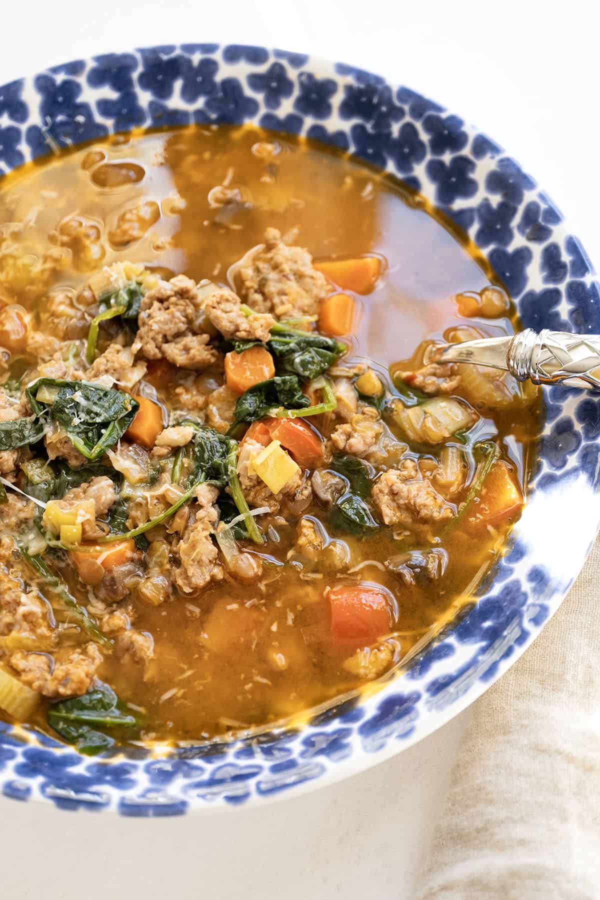 Bowl of sausage and lentil soup.