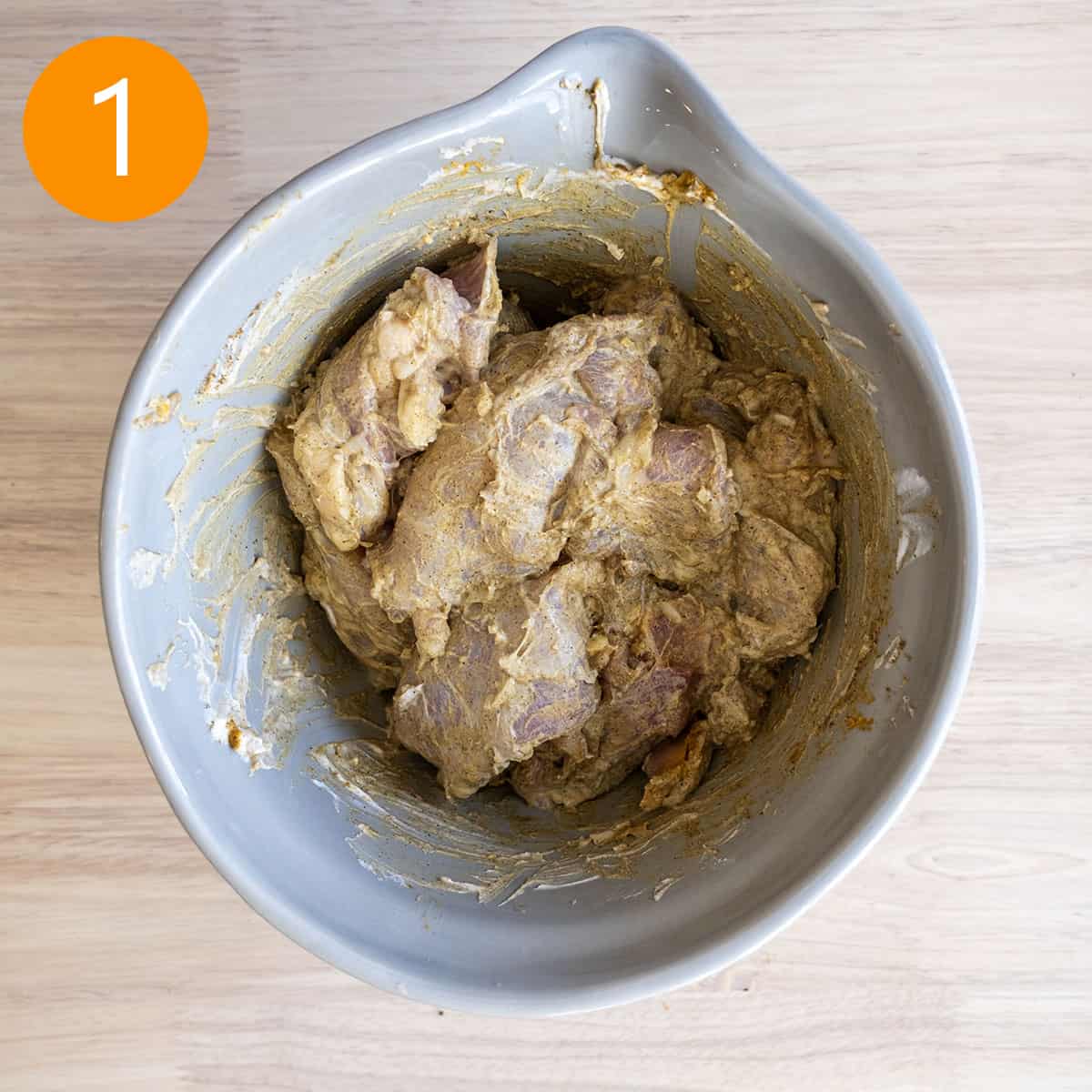 Marinating chicken thighs in yogurt.