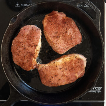 Searing pork chops on a cast iron.