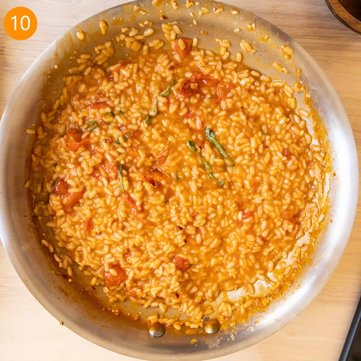 Finished risotto in pan with slight runniness to sauce to eventually be absorbed.