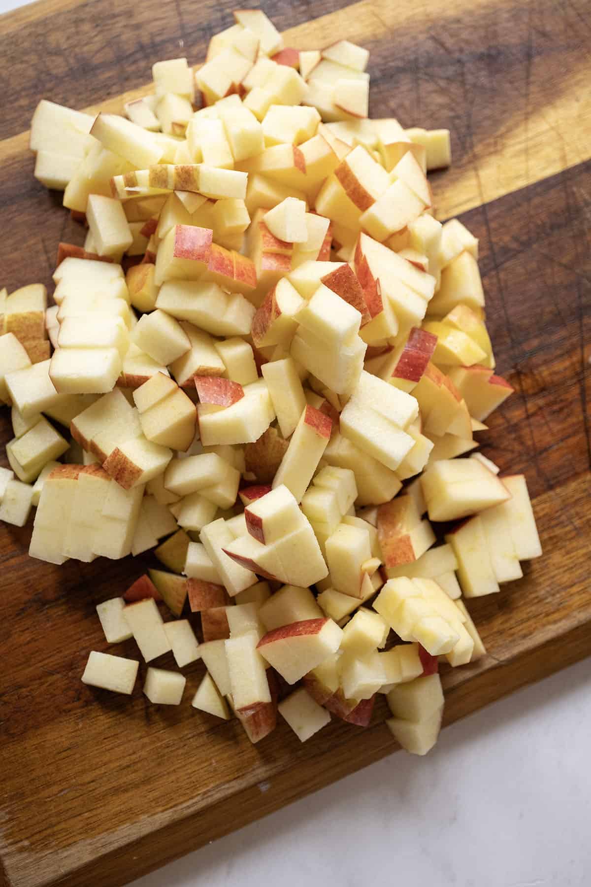 Apples chopped on a cutting board.