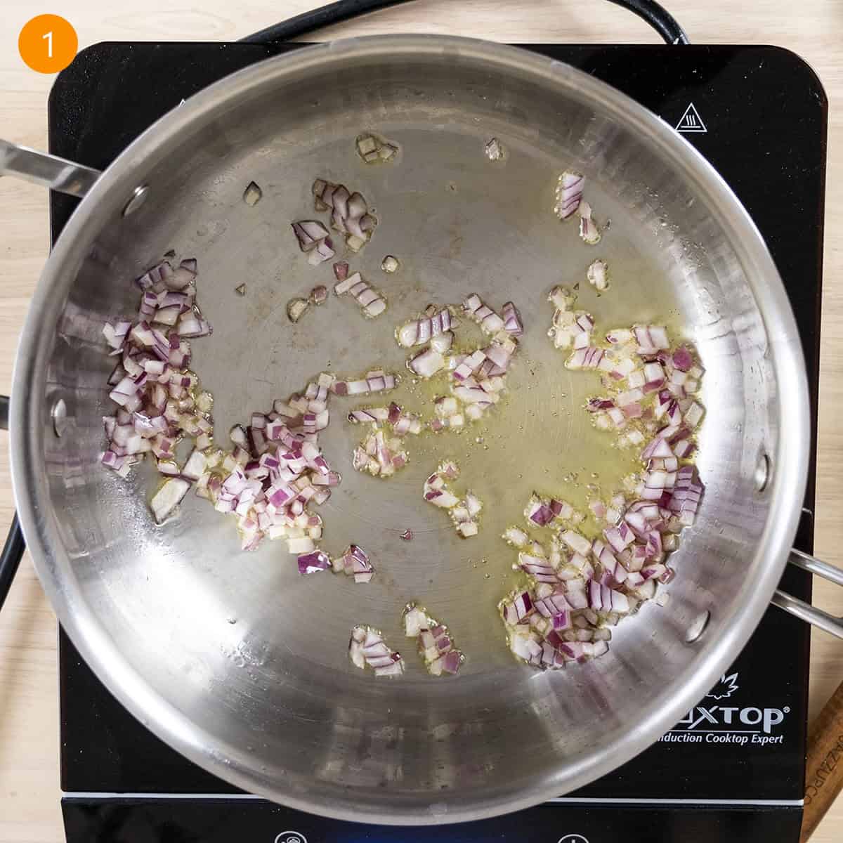 Sauteing onions in olive oil.