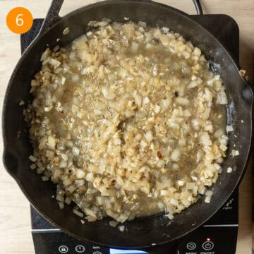 Simmering the onions and garlic with wine.