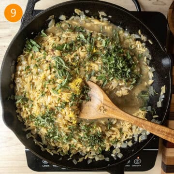 Adding heavy cream, basil, lemon, lemon zest, and parmesan to the orzo after chicken thighs have been removed.
