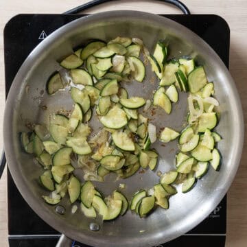 Zucchini sauteing with shallots.