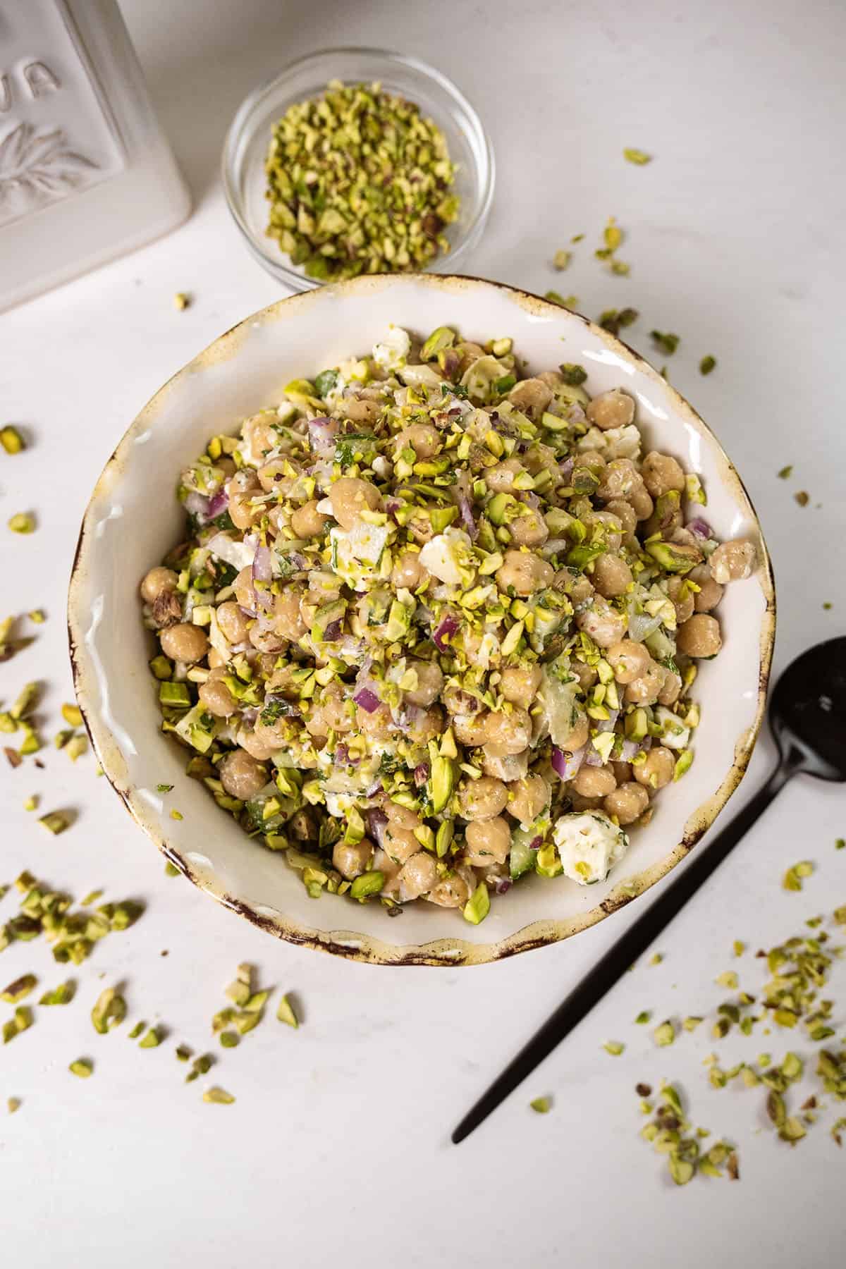 Chickpea salad with cucumbers in a bowl.