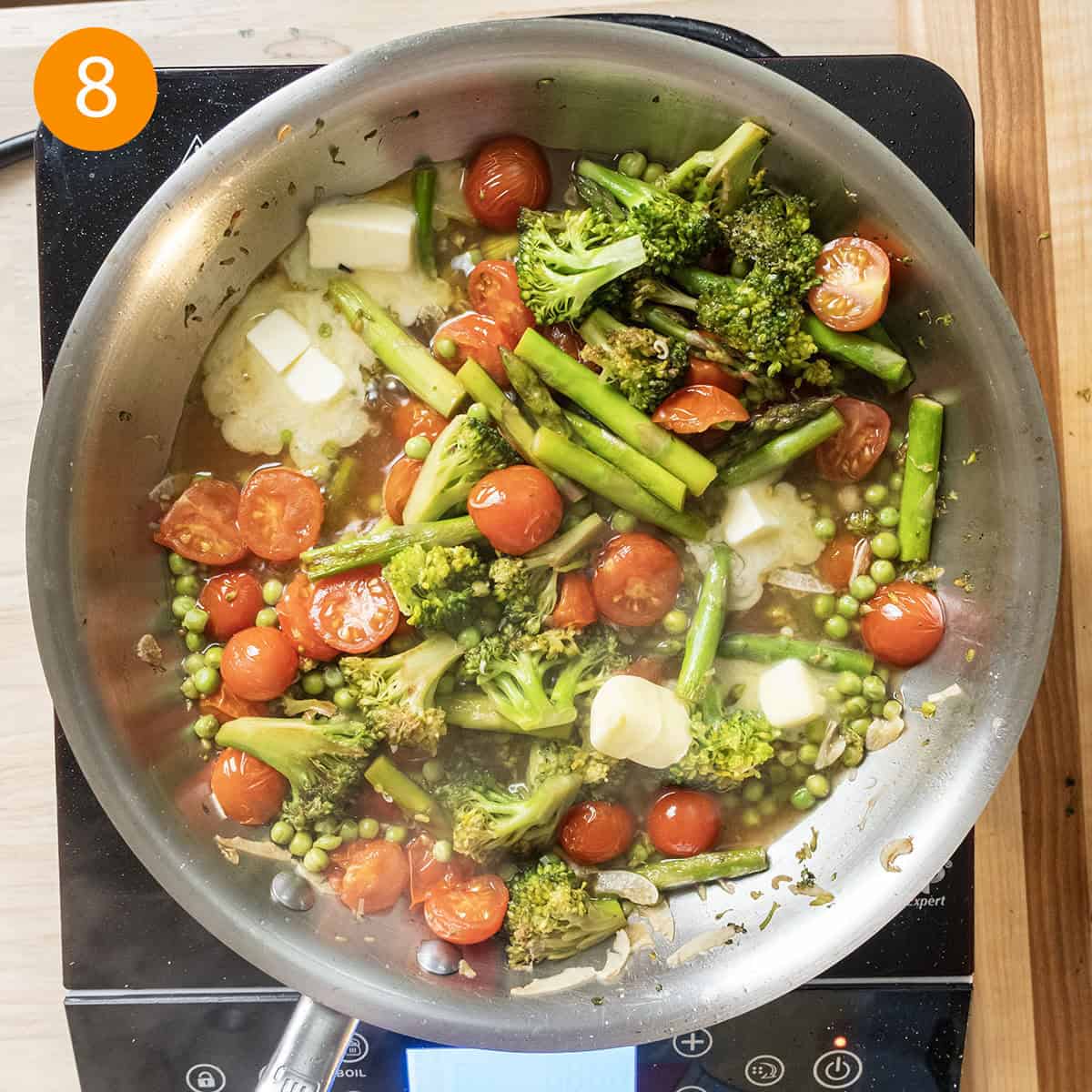 Stirring butter into the sauce.