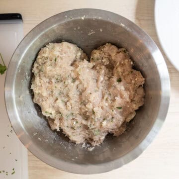 Ground chicken combined with parsley, gorgonzola, breadcrumbs, salt, and pepper.