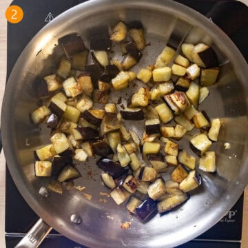 Eggplant frying in a pan.