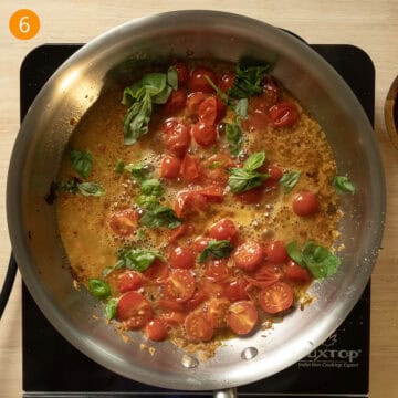 Basil and pasta water added to the cherry tomato and wine sauce.