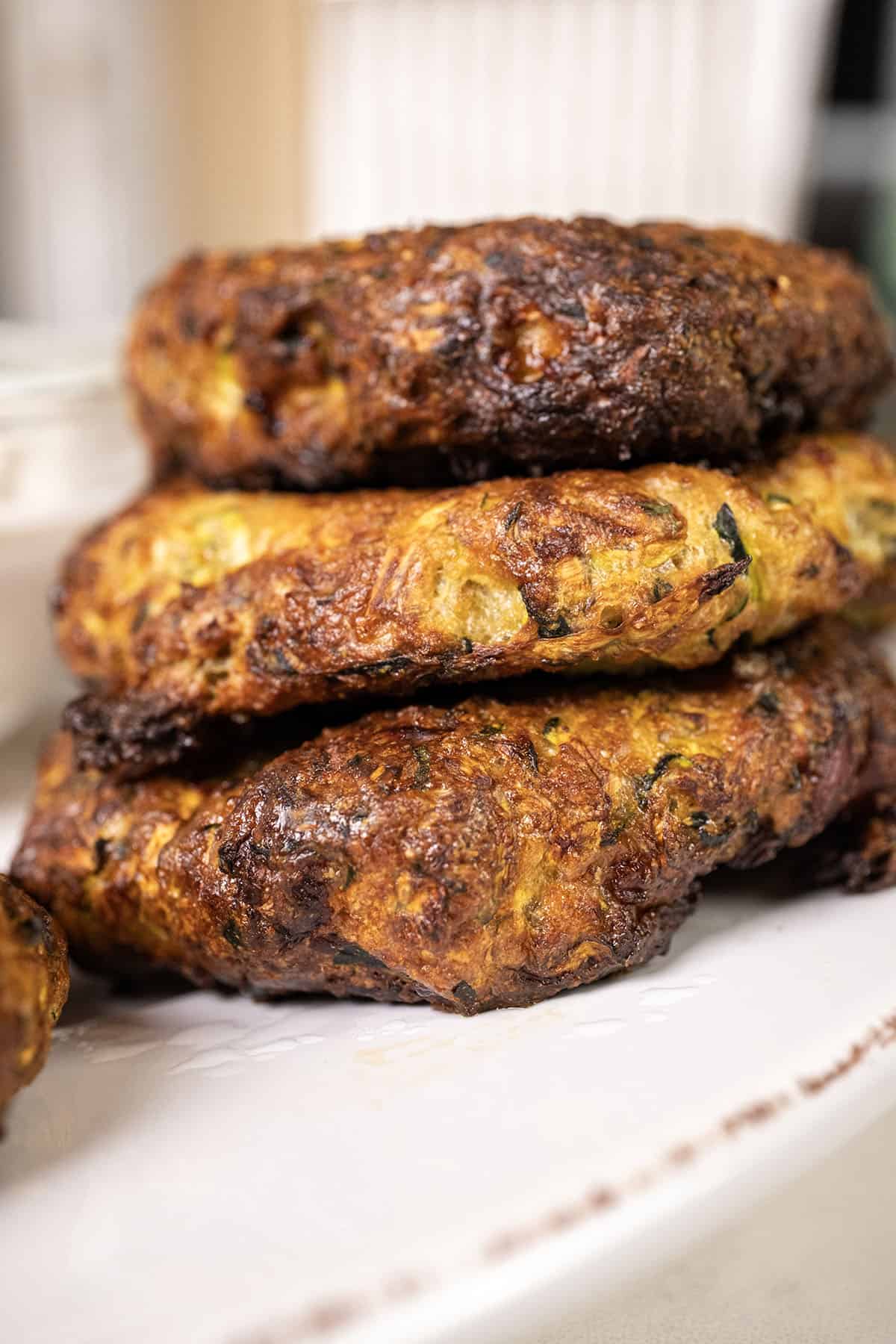 Zucchini fritters on a plate.