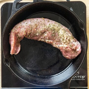 Searing pork tenderloin on the cast iron pan.