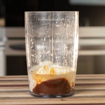 Chipotle mayo ingredients combined in a mixing cup.