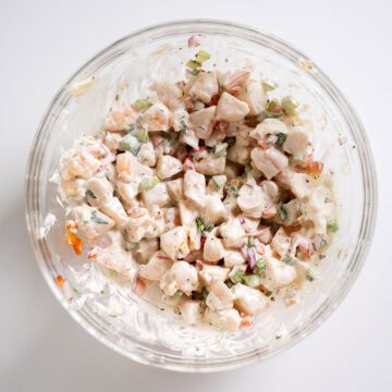 Combined chopped shrimp with mayo and vegetables.