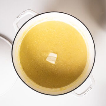 Polenta removed from the heat combined with butter and parmigiano.