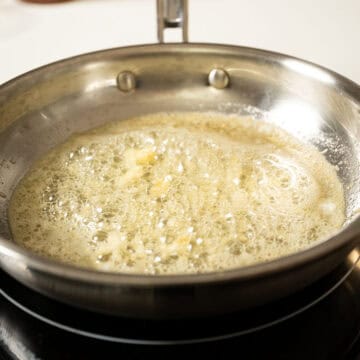 Sauteing garlic in butter.
