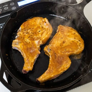 Glazing pork chops in a cast iron.