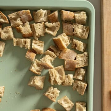 Dried bread on a baking sheet.