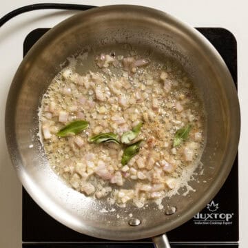 Sauteing shallots and sage in brown butter.