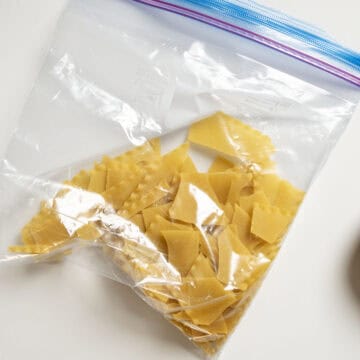Lasagna in a ziploc broken up.