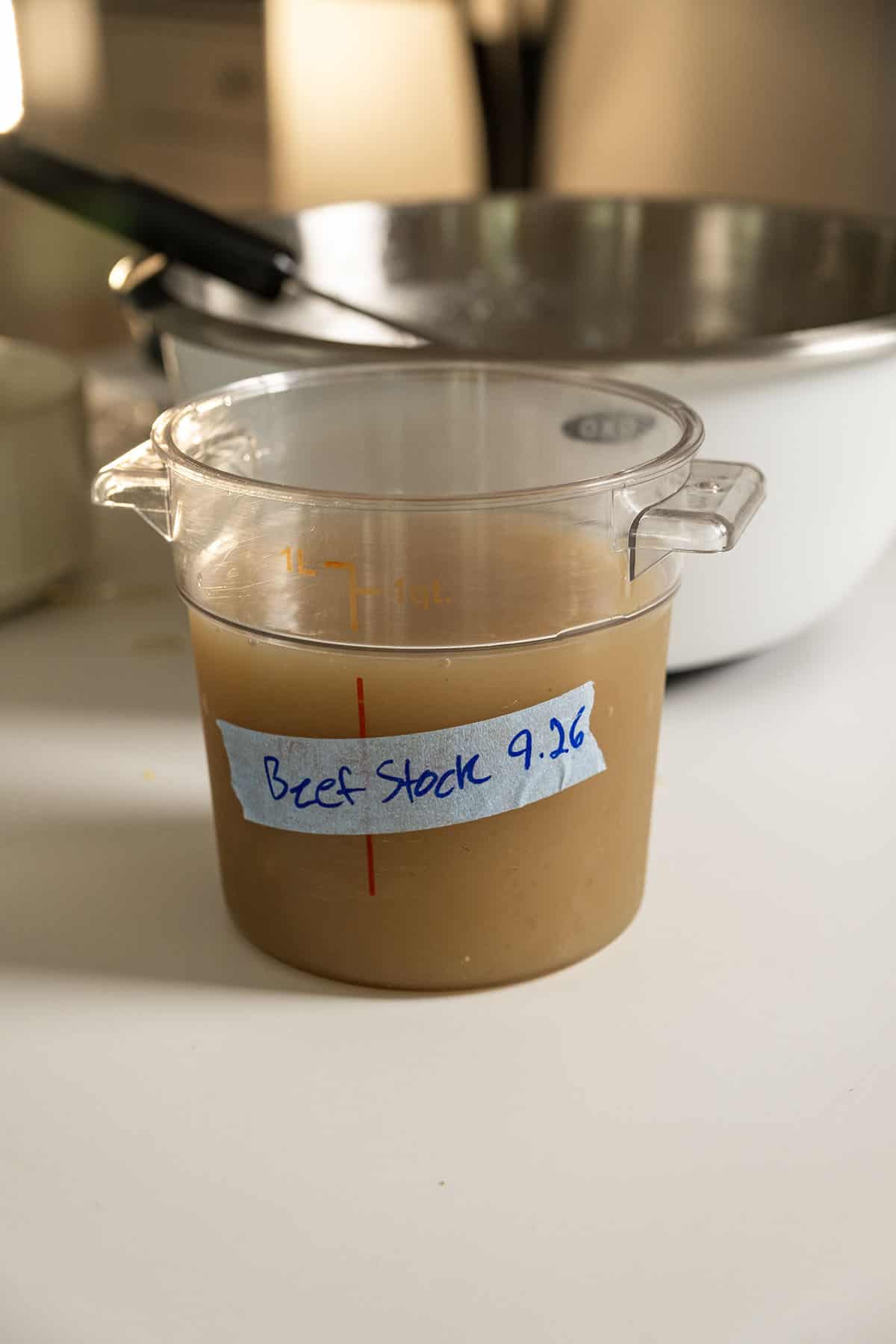 Beef stock in a container.