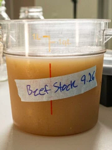 Beef stock in a container.