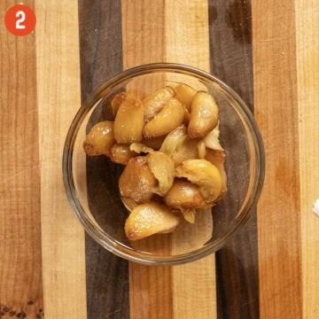 Garlic confit in a bowl.