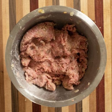 Combined ingredients in a bowl for meatloaf.