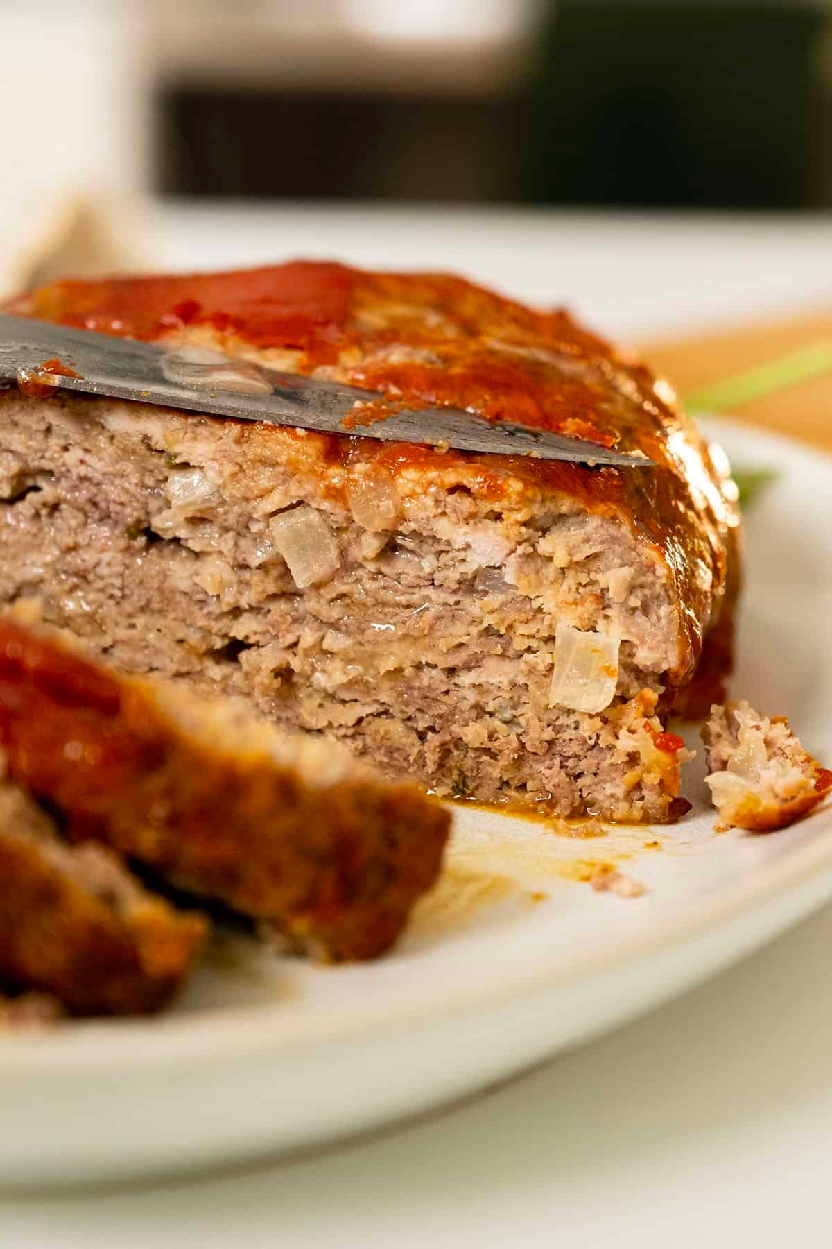 Italian meatloaf sliced on a plate.